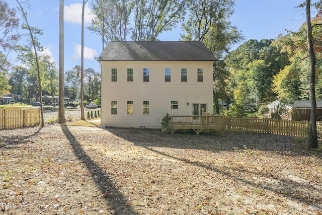 view of home's exterior with a wooden deck