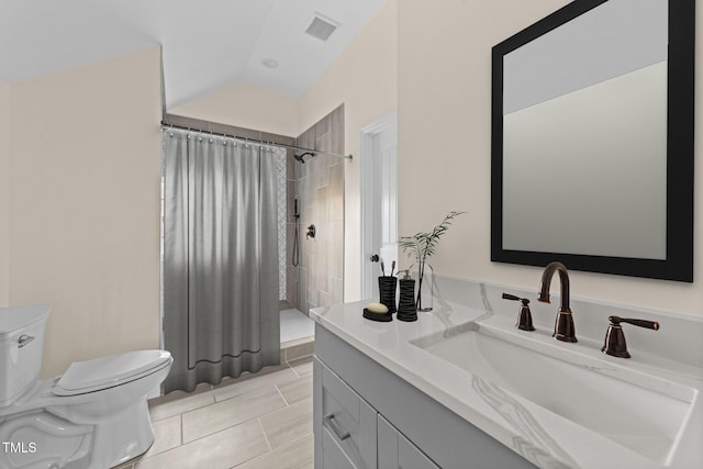 bathroom with tile patterned flooring, lofted ceiling, toilet, vanity, and a shower with shower curtain