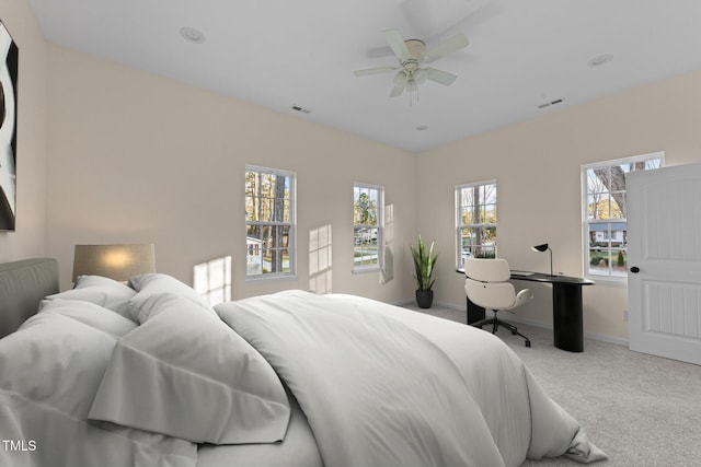 carpeted bedroom with ceiling fan