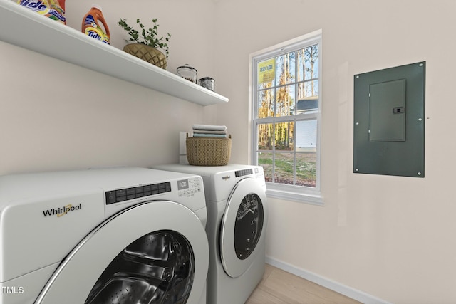 washroom featuring independent washer and dryer and electric panel