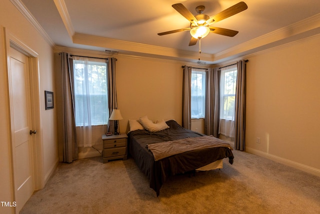 carpeted bedroom with crown molding, multiple windows, and ceiling fan