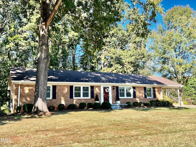 ranch-style home with a front yard