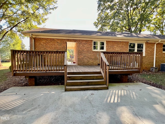 rear view of property featuring a patio, a deck, and central air condition unit