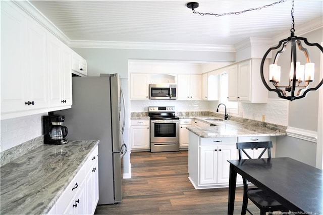 kitchen featuring crown molding, decorative light fixtures, stainless steel appliances, dark hardwood / wood-style floors, and white cabinetry