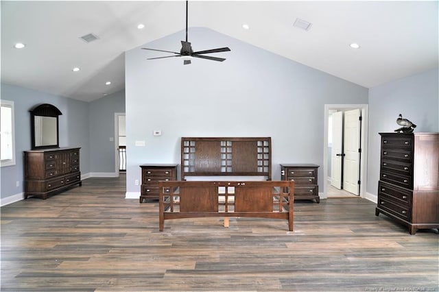 bedroom with dark wood-type flooring and high vaulted ceiling