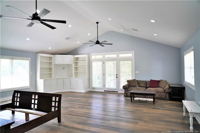 living room with ceiling fan, dark hardwood / wood-style floors, and high vaulted ceiling