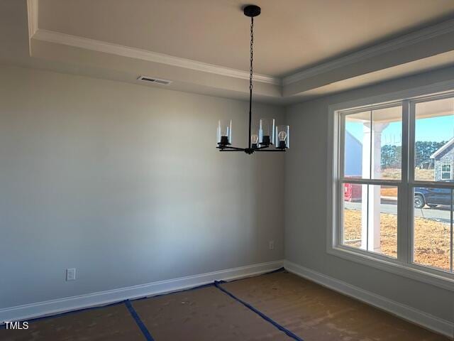 unfurnished dining area with a tray ceiling, a chandelier, and ornamental molding