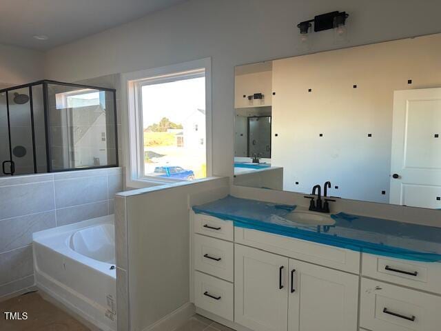 bathroom with vanity, separate shower and tub, and tile patterned flooring