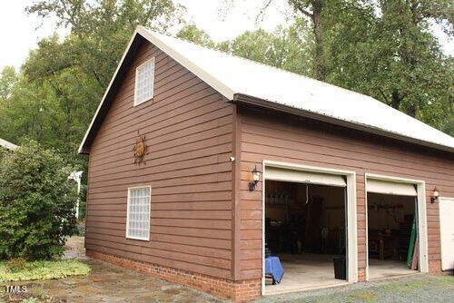 view of side of property featuring a garage