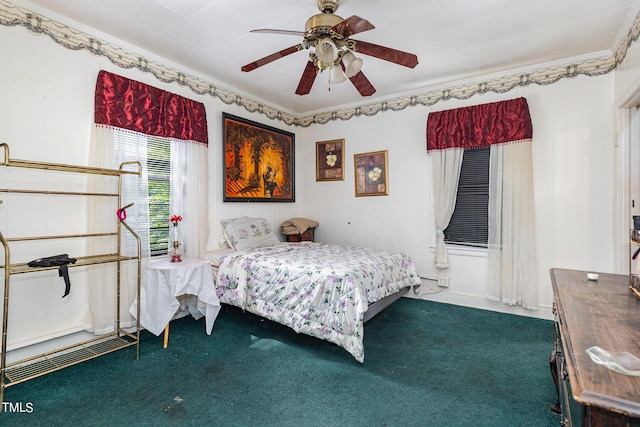 bedroom featuring crown molding, carpet floors, and ceiling fan