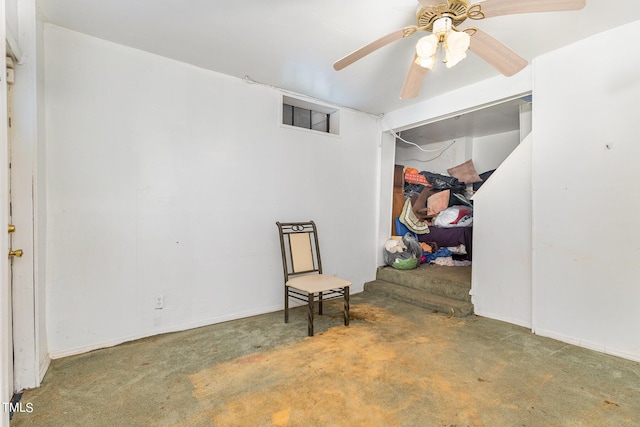 interior space featuring carpet floors and a ceiling fan