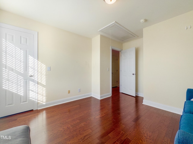 unfurnished living room with dark wood-type flooring