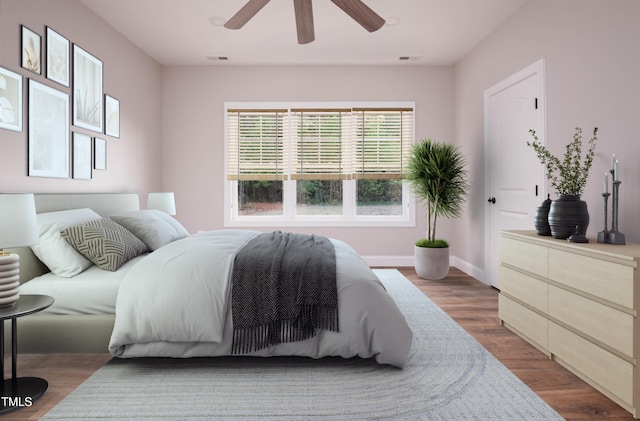 bedroom with ceiling fan and dark hardwood / wood-style floors