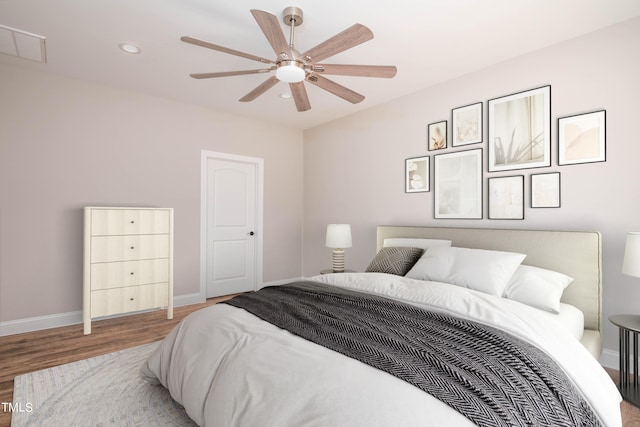 bedroom featuring ceiling fan and light wood-type flooring