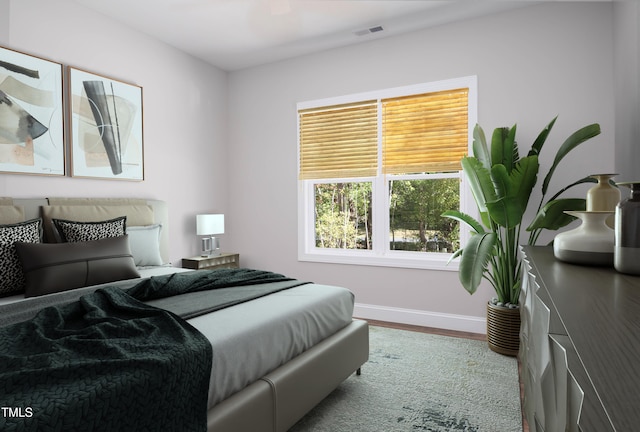 bedroom with hardwood / wood-style flooring