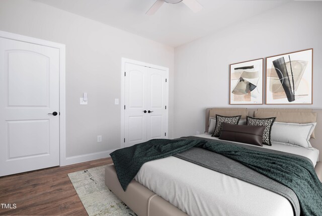 bedroom with dark hardwood / wood-style flooring, a closet, and ceiling fan