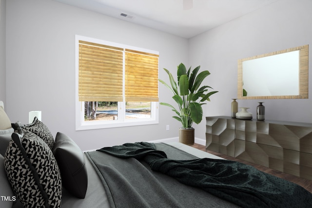 bedroom featuring ceiling fan and hardwood / wood-style floors