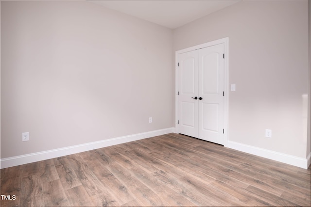 empty room featuring hardwood / wood-style floors