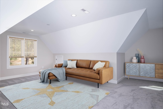 carpeted bedroom with lofted ceiling