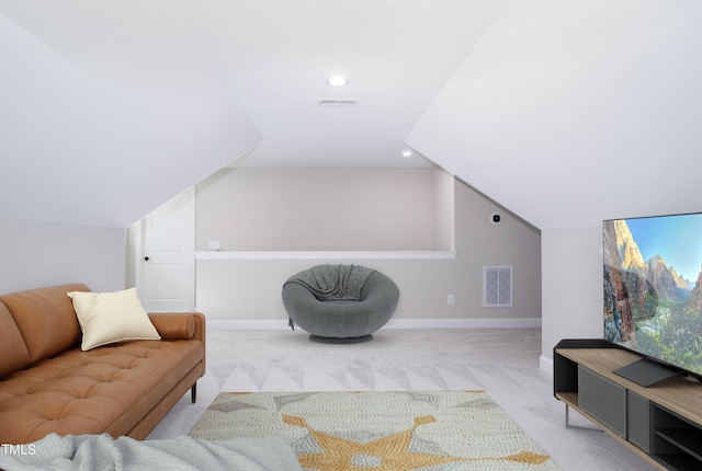 interior space featuring light carpet and lofted ceiling