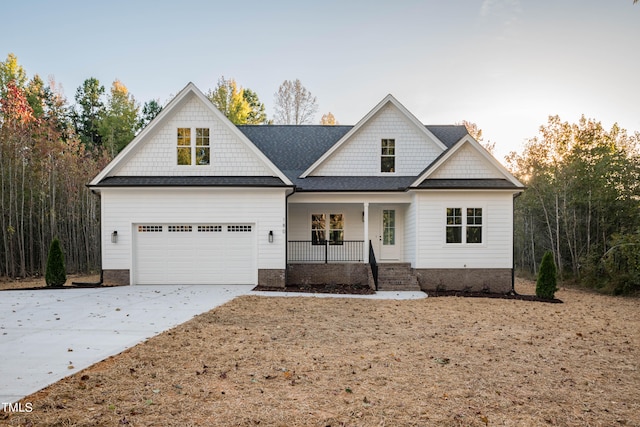 craftsman-style house featuring covered porch and a garage