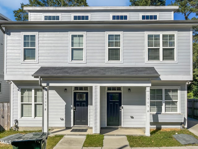 view of front facade featuring fence