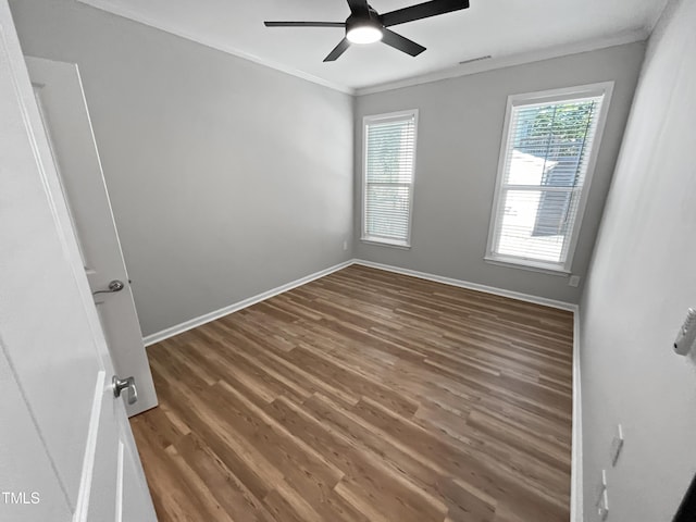 1505 Juniper St, Durham, NC 27703 - spare room with ornamental molding, wood finished floors, ceiling fan, and baseboards