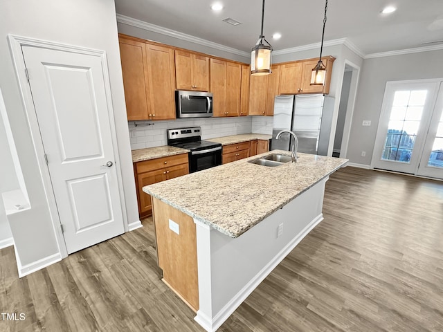 1505 Juniper St, Durham, NC 27703 - kitchen featuring stainless steel appliances, a sink, crown molding, wood finished floors, and decorative backsplash