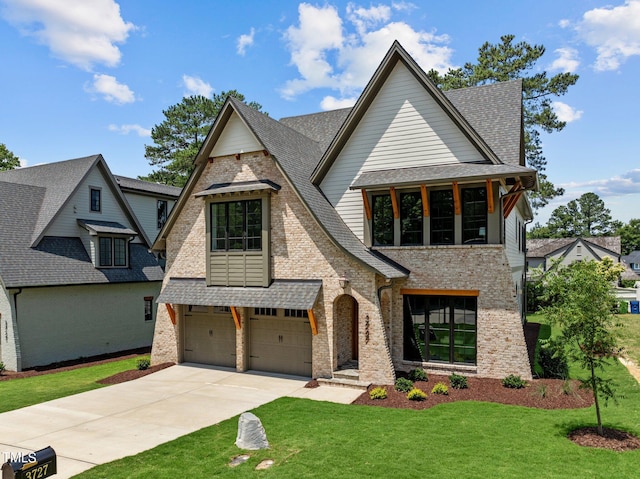 view of front of house featuring a front yard and a garage