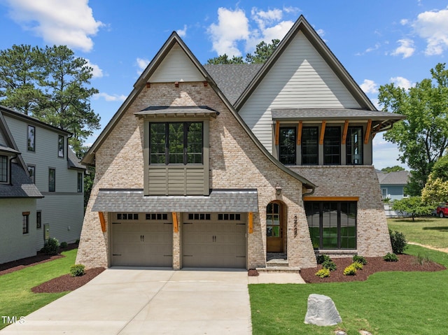 view of front of house with a front lawn and a garage