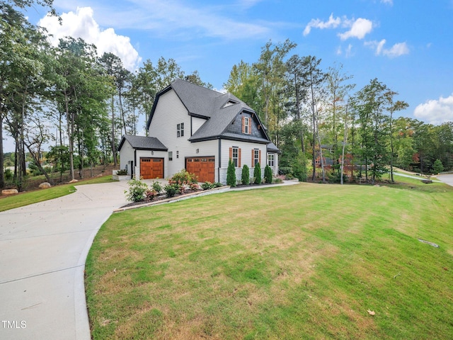 view of front of home featuring a front yard and a garage