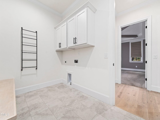 laundry area with cabinets, washer hookup, hookup for an electric dryer, hookup for a gas dryer, and ornamental molding