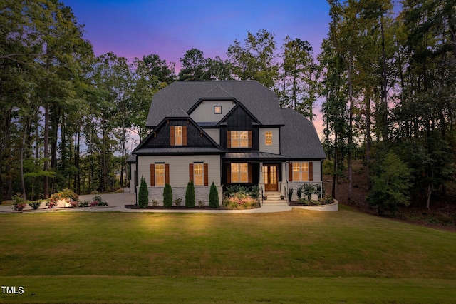 view of front of house with a yard