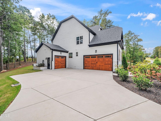 view of side of home featuring a garage