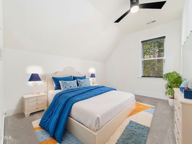 carpeted bedroom with ceiling fan and lofted ceiling