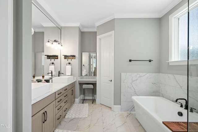 full bathroom featuring a sink, a freestanding bath, marble finish floor, double vanity, and crown molding