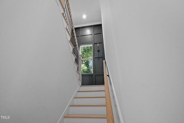 staircase featuring recessed lighting