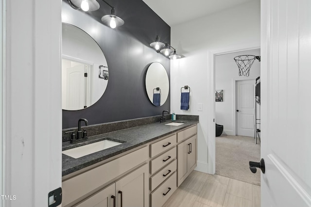 full bath with double vanity and a sink