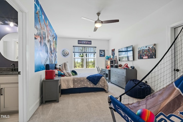 bedroom with a ceiling fan and light colored carpet