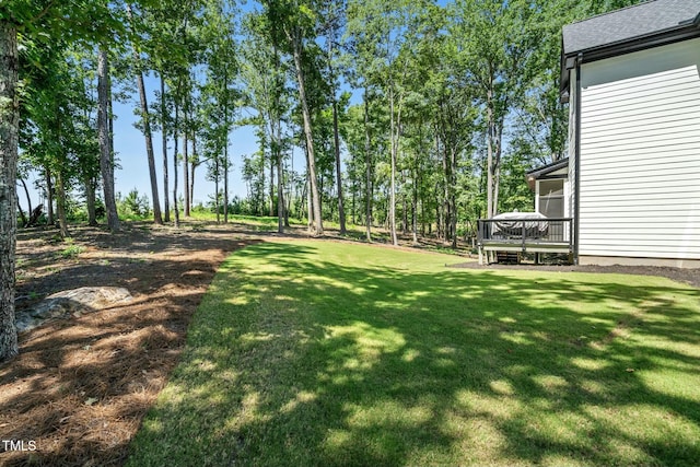 view of yard with a deck