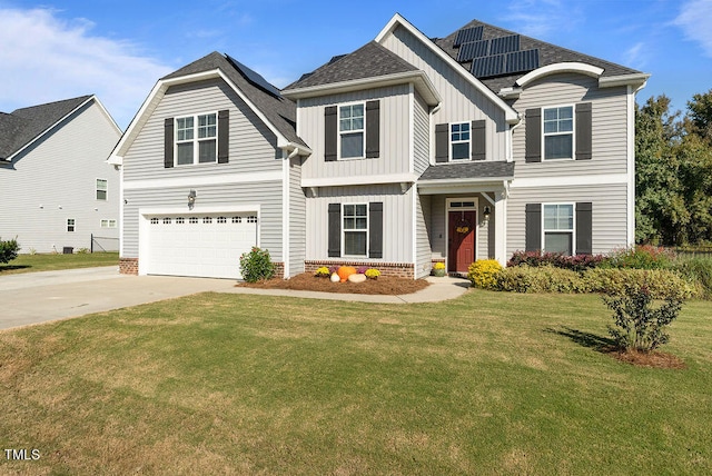 view of front of house with a garage and a front lawn