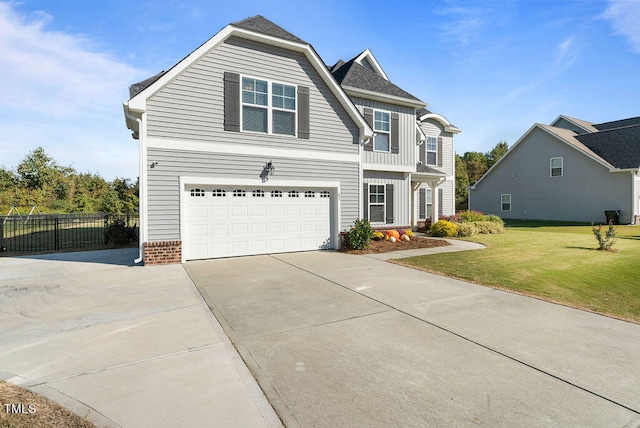 front of property with a garage and a front lawn