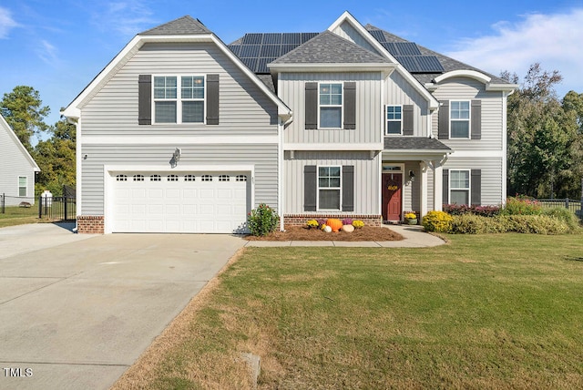 view of front of home with a garage and a front yard