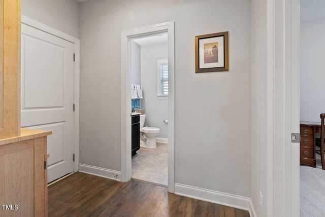 hallway featuring dark hardwood / wood-style floors