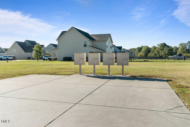 view of basketball court with a yard