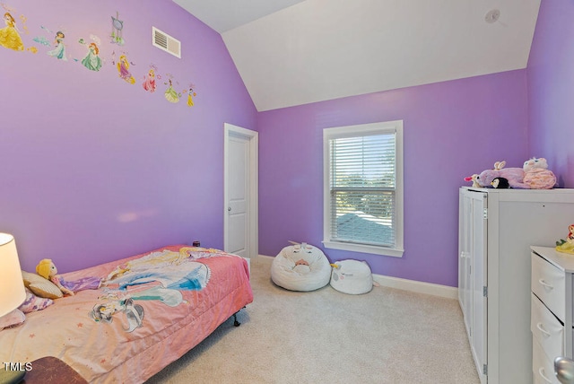 bedroom featuring vaulted ceiling and light carpet