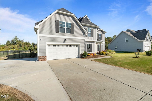 view of front facade featuring a garage and a front lawn