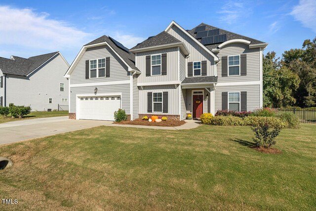 view of front facade featuring a garage and a front lawn