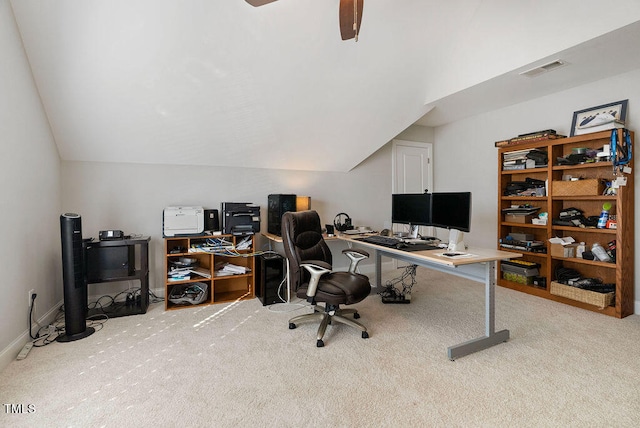 office area featuring ceiling fan, lofted ceiling, and light carpet