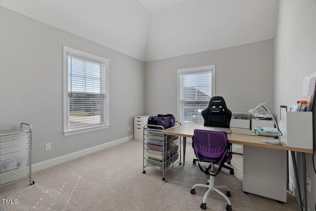 carpeted office featuring vaulted ceiling and a wealth of natural light